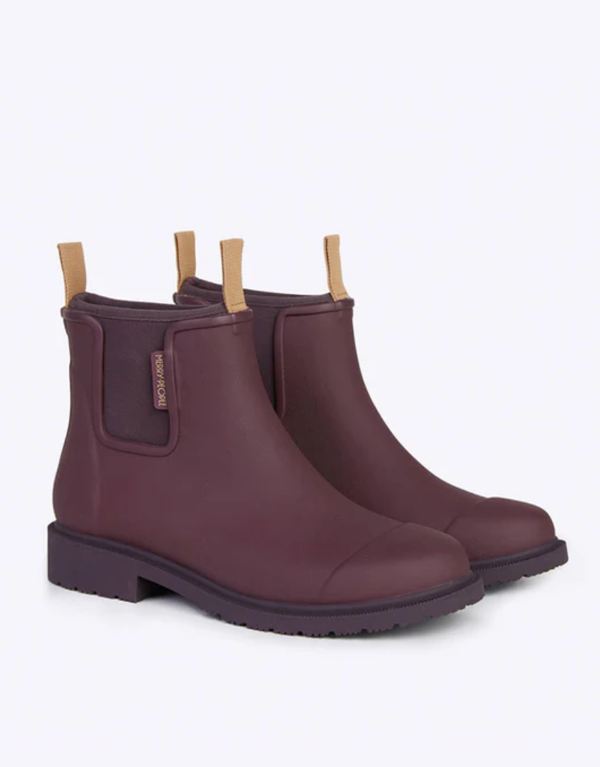 Dark cherry Merry People Bobbi gumboots with black rubber soles, stylish waterproof footwear for rainy days.