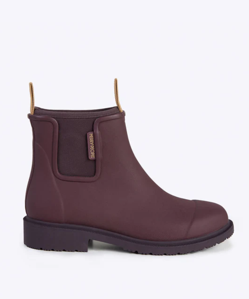 Dark cherry Merry People Bobbi gumboots on a white background, showcasing waterproof rubber footwear with textured soles.