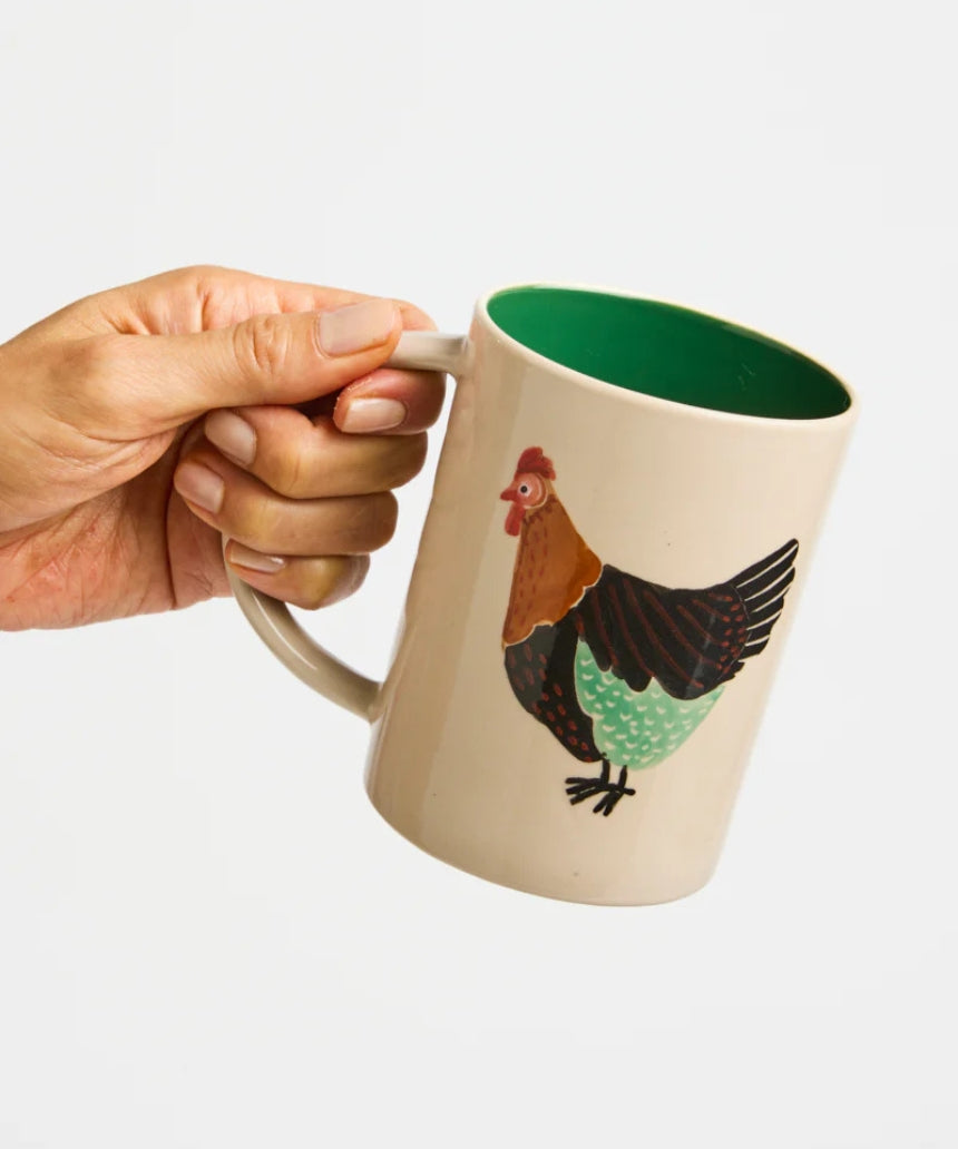 Jones & Co Coop Clover Mug featuring a green clover design on a ceramic mug with a white background.