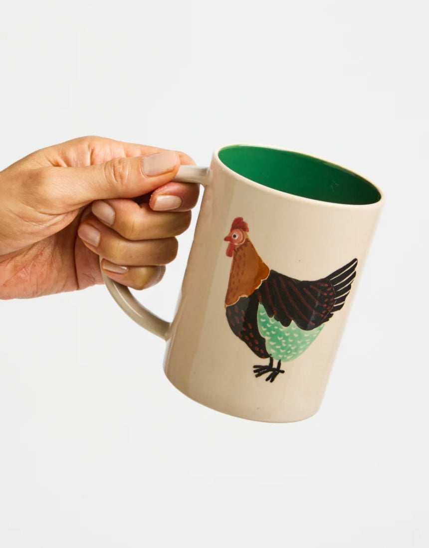 Jones & Co Coop Clover Mug featuring a green clover design on a ceramic mug with a white background.