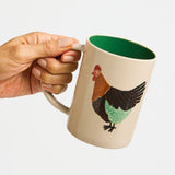 Jones & Co Coop Clover Mug featuring a green clover design on a ceramic mug with a white background.