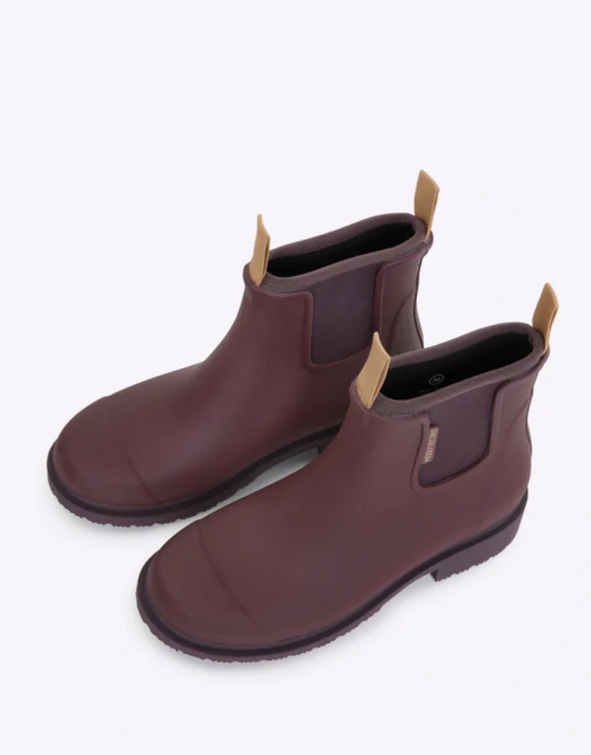 Dark cherry Merry People Bobbi gumboots with glossy finish and sturdy soles, designed for waterproof outdoor wear.