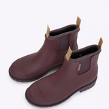 Dark cherry Merry People Bobbi gumboots with glossy finish and sturdy soles, designed for waterproof outdoor wear.