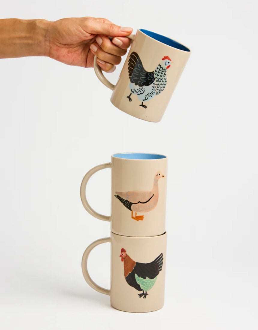Jones & Co Coop Clover Mug featuring a green clover design, ceramic mug with a smooth handle and vibrant print.