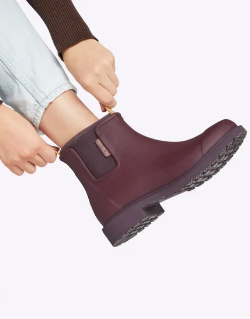Dark cherry Merry People Bobbi gumboots with waterproof design and glossy finish, suitable for rainy weather.