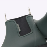 Forest green Merry People Bobbi gumboots shown with shiny rubber finish and sturdy soles, perfect for rainy weather.