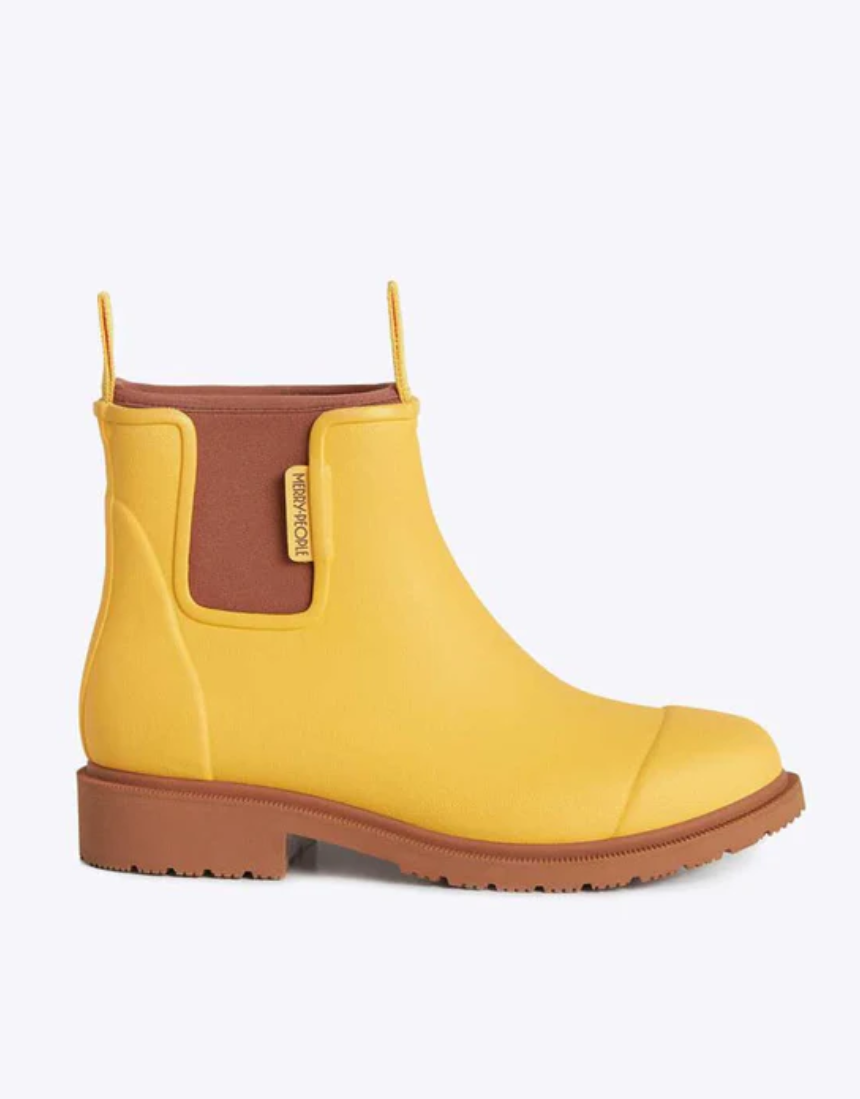 Yellow Merry People Bobbi gumboots with sunflower pattern, waterproof rubber footwear for rainy days.