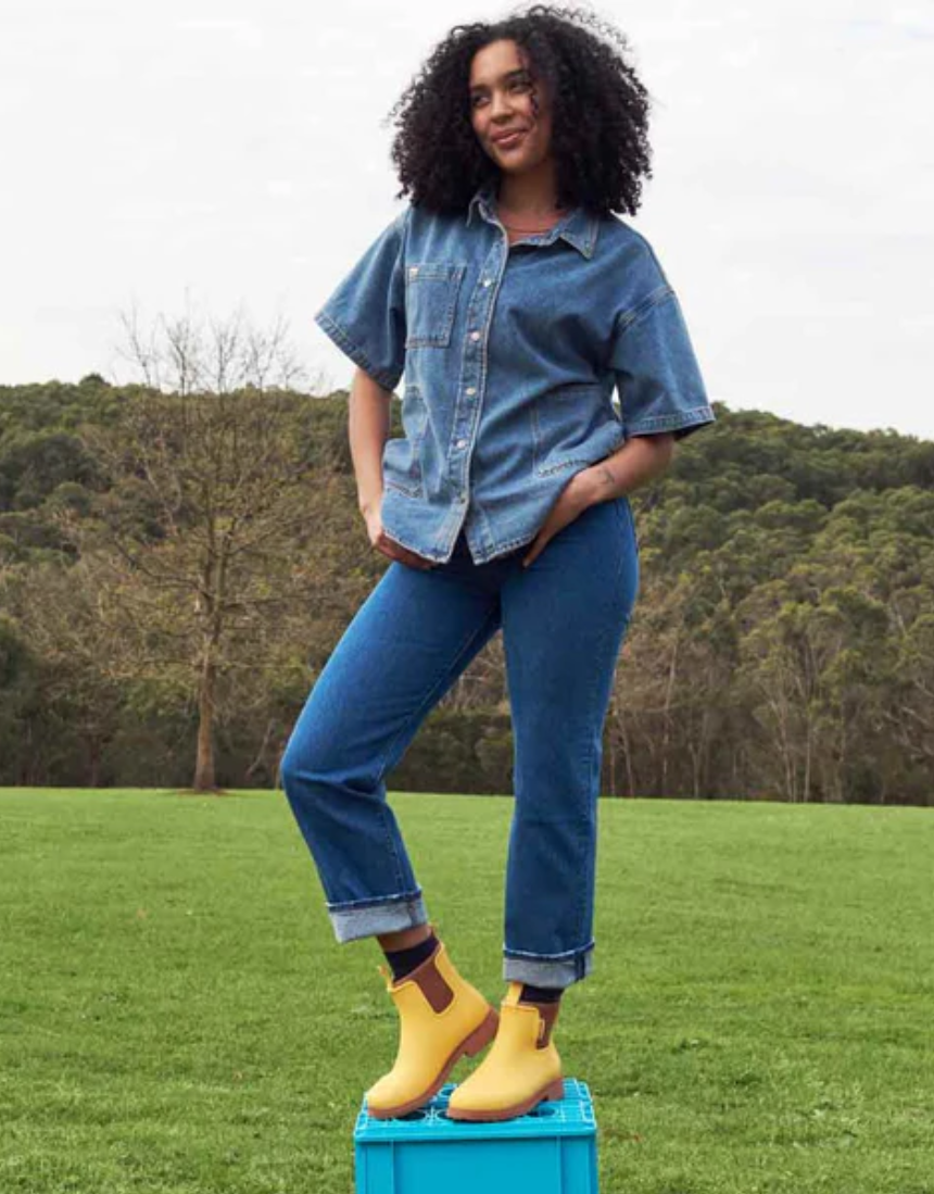 Merry People Bobbi Gumboot in Sunflower Yellow, waterproof rain boots with a vibrant yellow color and slip-resistant sole.