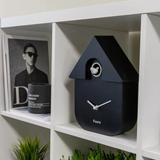 Fisura Casita Black cuckoo clock with a charming black wooden house design and traditional clock face.