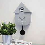 Fisura grey and black cuckoo clock house with dial, detailed wooden design, traditional style, and functional clock face.