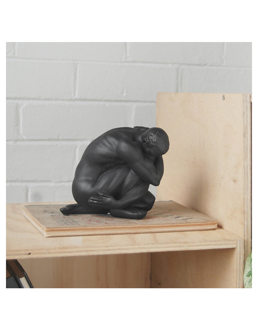 White Moose Body Sculpture Aydian in black, detailed black sculpture of a human figure with artistic features.