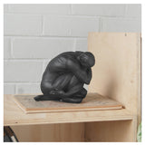 White Moose Body Sculpture Aydian in black, detailed black sculpture of a human figure with artistic features.