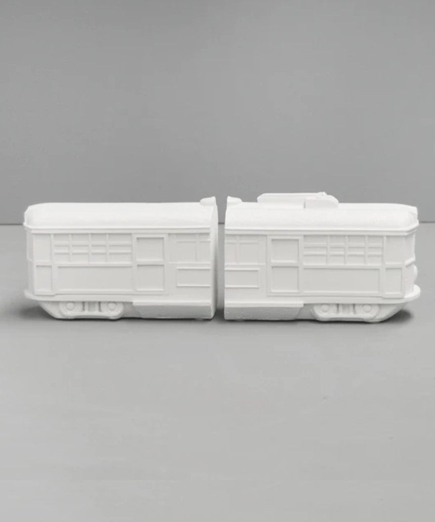 White Moose Tram Bookends in white, featuring modern tram design to hold and organize books on a shelf.