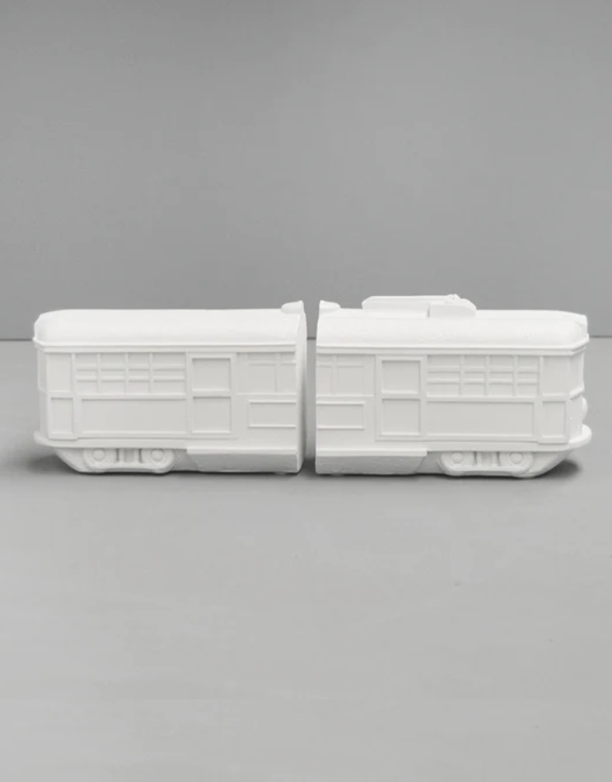 White Moose Tram Bookends in white, featuring modern tram design to hold and organize books on a shelf.