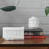 White Moose Tram Bookends in white, featuring a modern design to hold and display books on a shelf.