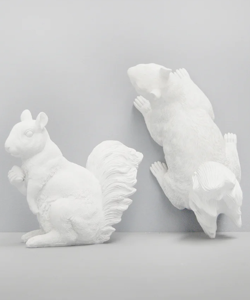 White Moose squirrel twin set of homeware items in white, featuring detailed squirrel designs on soft fabric.