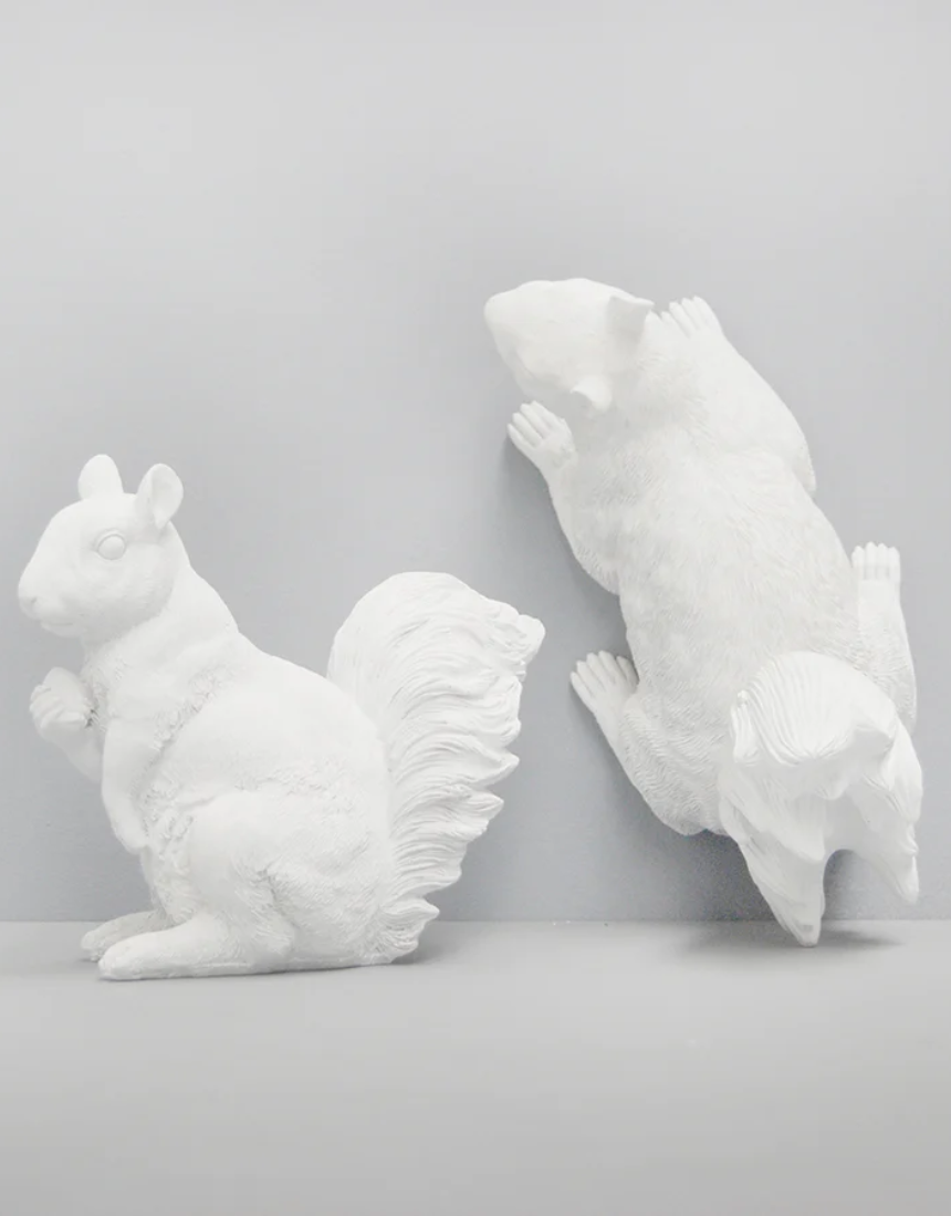 White Moose squirrel twin set of homeware items in white, featuring detailed squirrel designs on soft fabric.