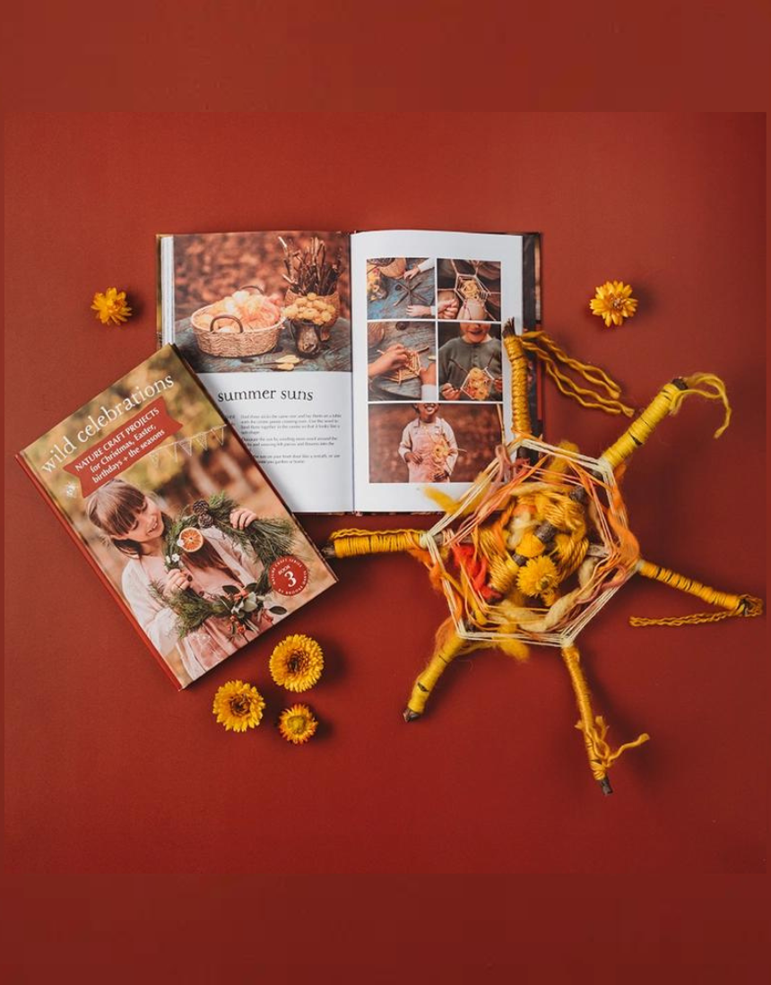 Open pages of Your Wild Books Wild Celebrations Book showing colorful illustrations and handwritten notes inside.