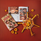 Open pages of Your Wild Books Wild Celebrations Book showing colorful illustrations and handwritten notes inside.