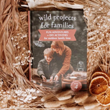Open page of Your Wild Books Wild Projects For Families book showing colorful illustrations and creative activity ideas.