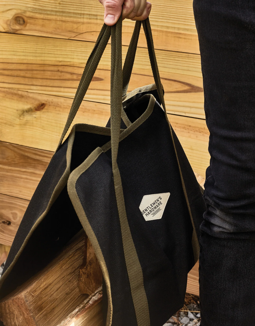 Gentlemen's Hardware log carrier for camping tools, made of durable material, designed for carrying firewood easily.
