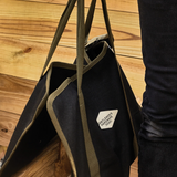Gentlemen's Hardware log carrier for camping tools, made of durable material, designed for carrying firewood easily.