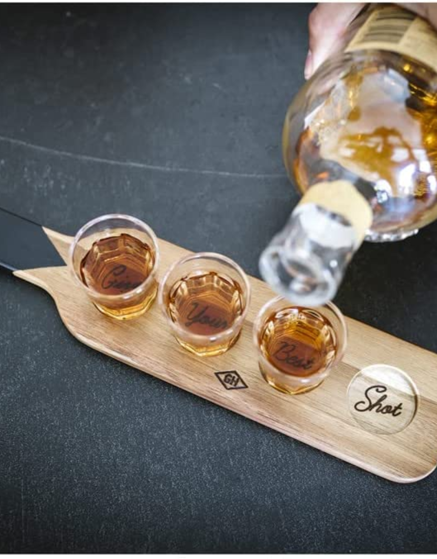Set of Gentlemen's Hardware shot glasses with a serving paddle, featuring rustic wood and glass design for stylish serving.