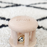 Wooden rattle toy called Bella the Bell from Jaclyn and Matisse, designed for infants and children to shake and play.