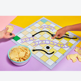Journey of Something 3-in-1 game set featuring chess, checkers, snakes and ladders on a colorful game board.