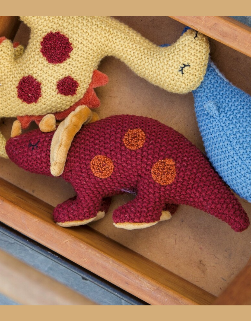 Lily & George Tracey Triceratops plush toy rattle with soft fabric and colorful details, designed for young children.