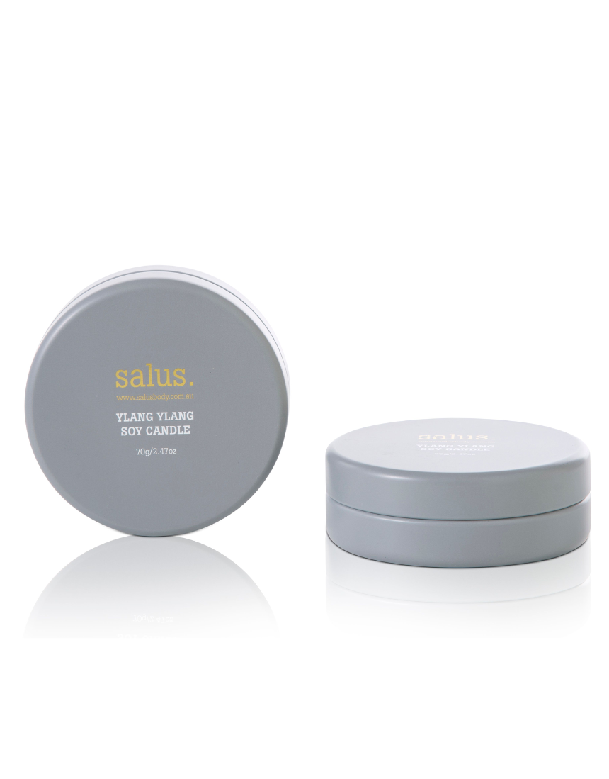 Salus Ylang Ylang Travel Soy Candle with floral scent in a small glass container, ideal for portable relaxation and aromatic ambiance.