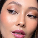Suzy Lipsticks Miss Brooklyn Rose satin lipstick in a sleek tube, showcasing the rich rose shade and luxurious finish.
