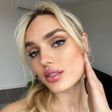 Suzy Lipsticks Miss Brooklyn Rose Satin Luxe lipstick in a sleek tube, showing the rich rose shade and satin finish.