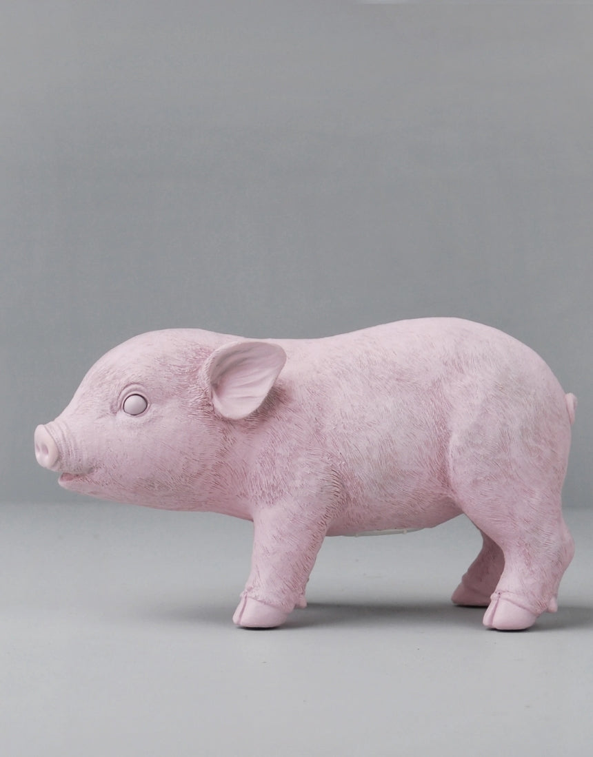 Pink pig-shaped money box from White Moose homewares collection, designed for saving coins and decorative display.
