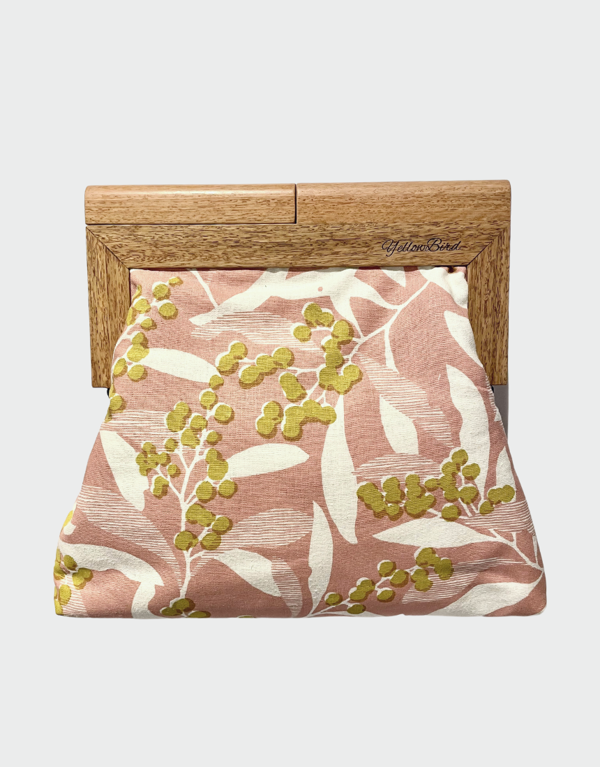 Yellow Bird Signature Medium Clutch with Wattle Tassie Oak frame, showcasing a sleek yellow leather design and elegant craftsmanship.