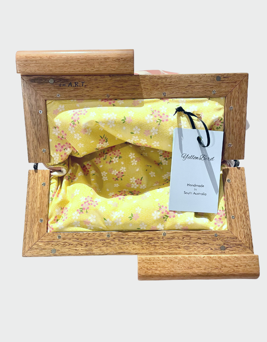 Yellow Bird Signature Medium Clutch with Wattle Tassie Oak frame, showcasing a stylish yellow bird design and elegant craftsmanship.